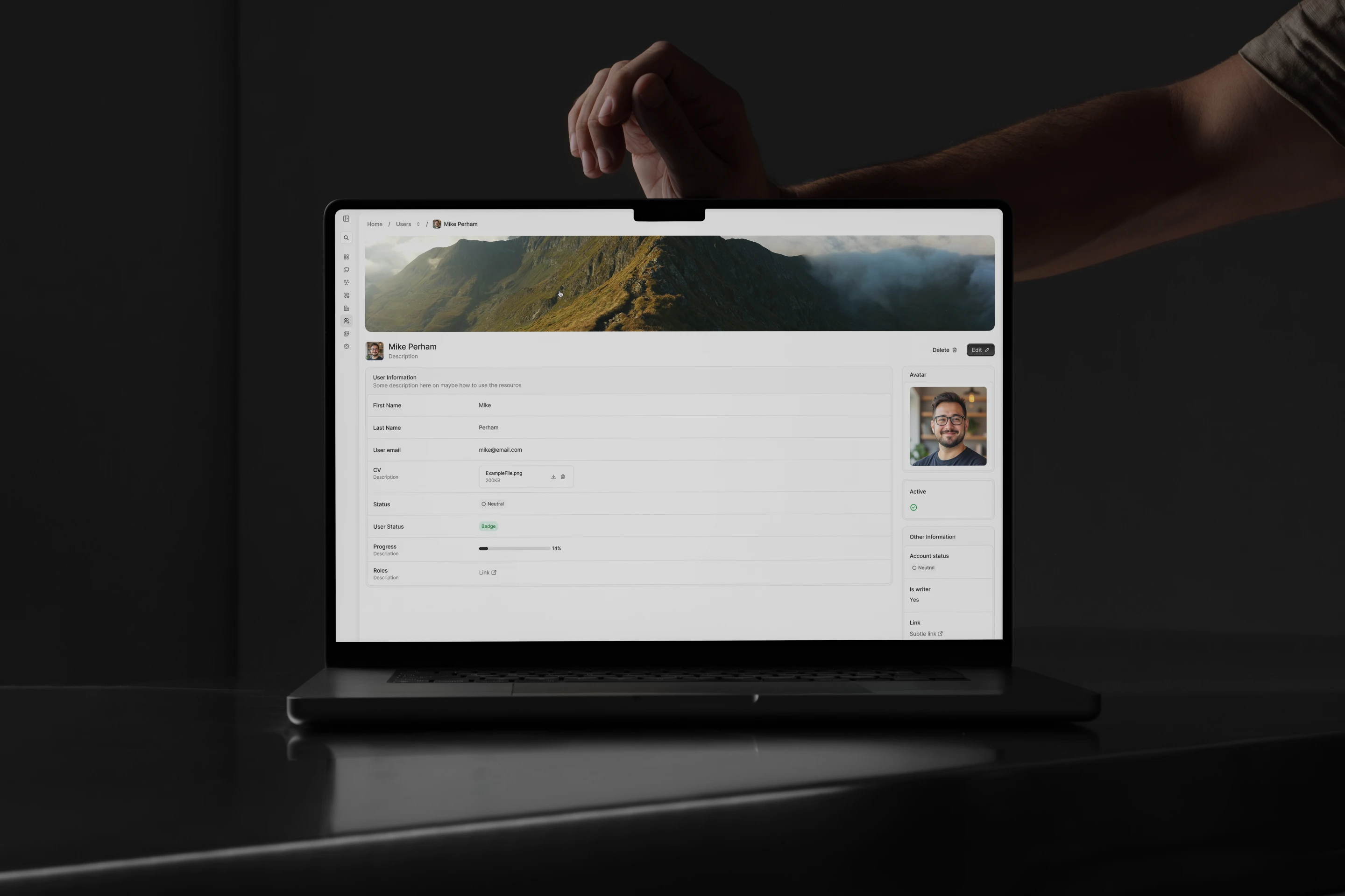 Avo UI 4 running on a laptop in a dark studio: a record page with a profile, form fields and an avatar