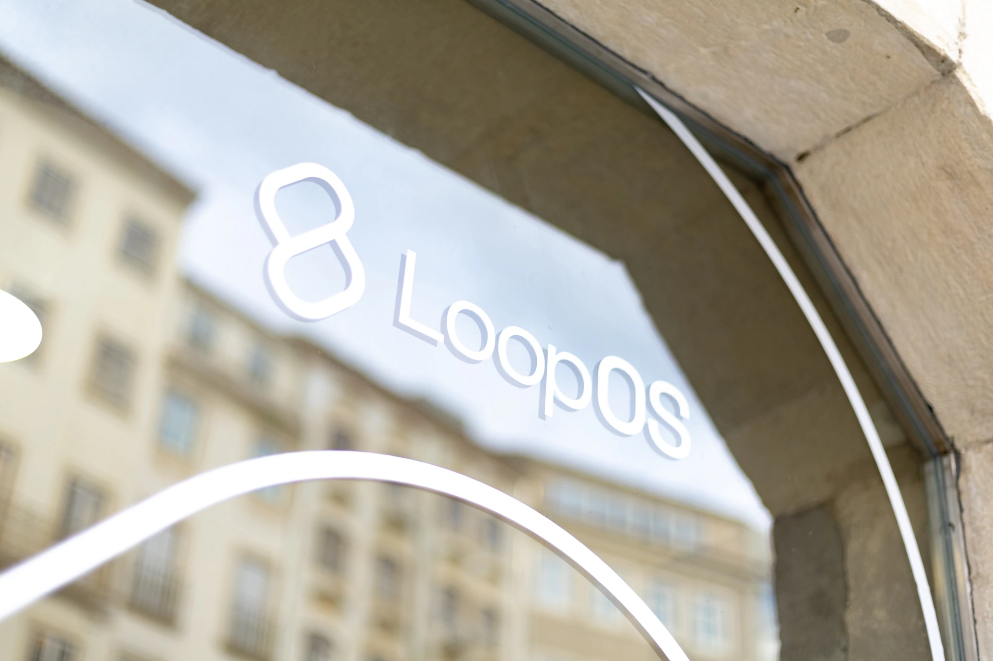 The LoopOS mark in vinyl on the office window