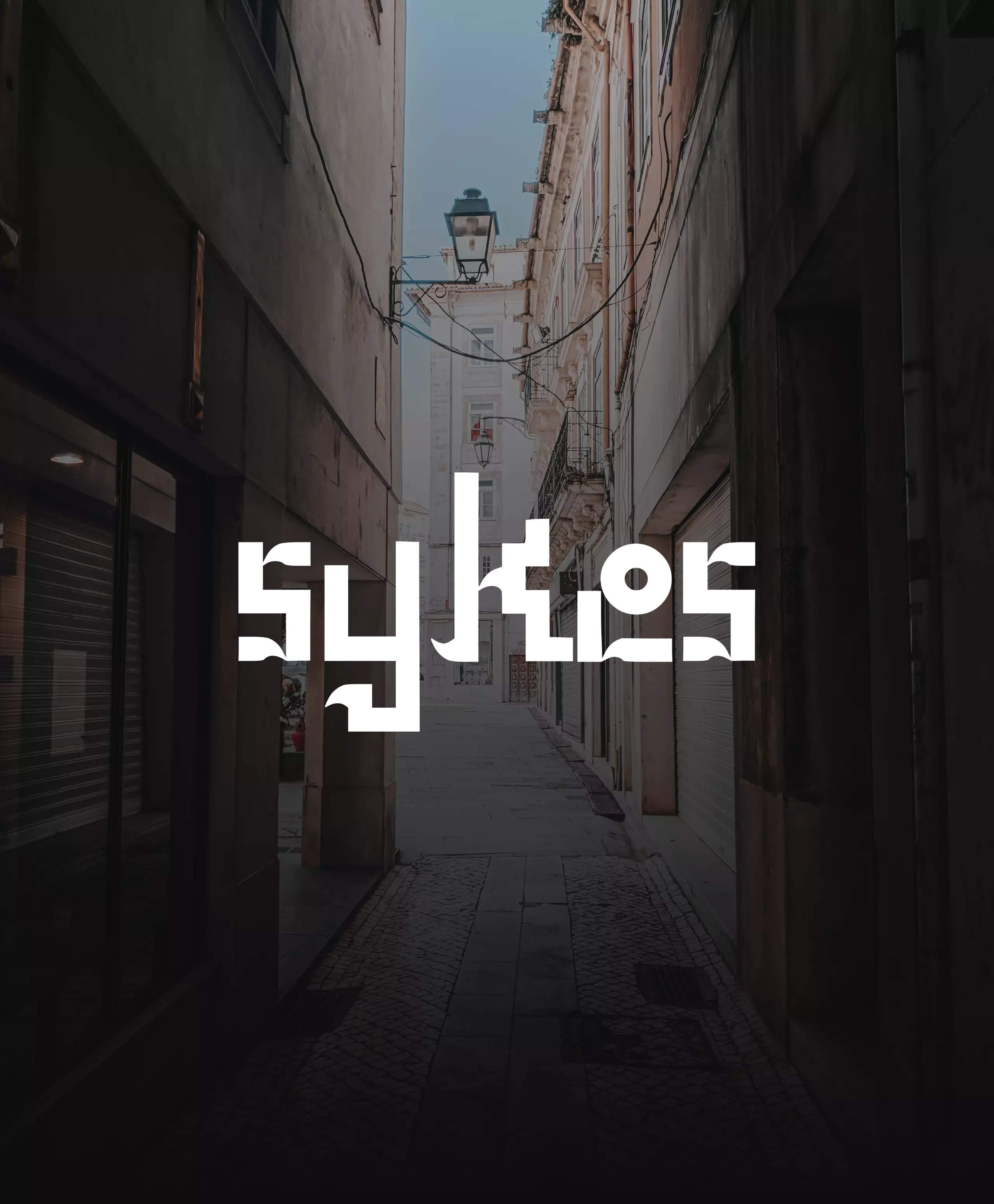 “sykes” set in the typeface, over Coimbra street lettering